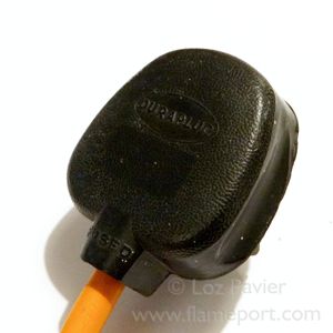 Black rubber 13 amp Duraplug with orange flex