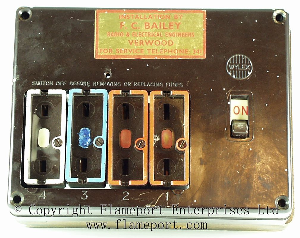 Wooden frame and busbar assembly Brown Wylex fuse box with fuses removed