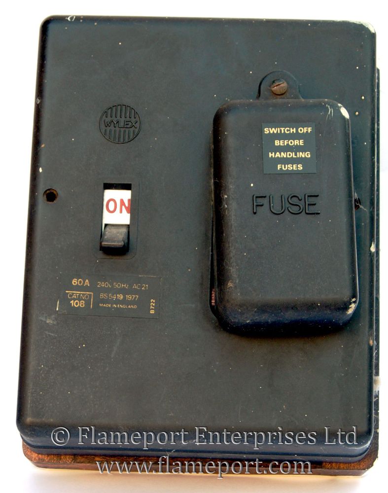 1 way Wylex fusebox with fuse cover removed 1 way Wylex 60A switchfuse, wood frame with brown plastic cover